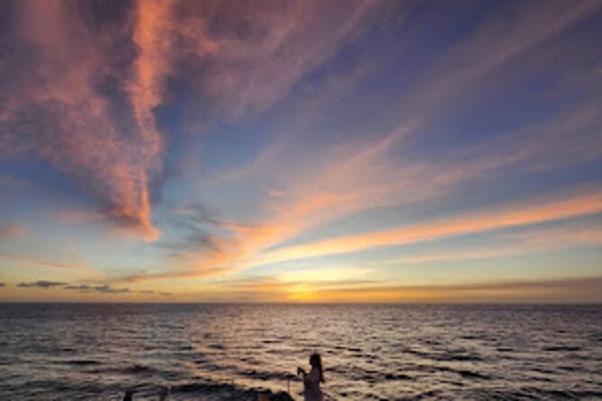 All-Inclusive Sunset Dolphin Watch and Snorkeling Cruise - Snorkeling in warm, clear water
