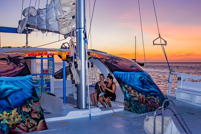 Aruba Sunset Sail Cruise Aboard The Dolphin Catamaran - A sunset cruise with a swim stop built in