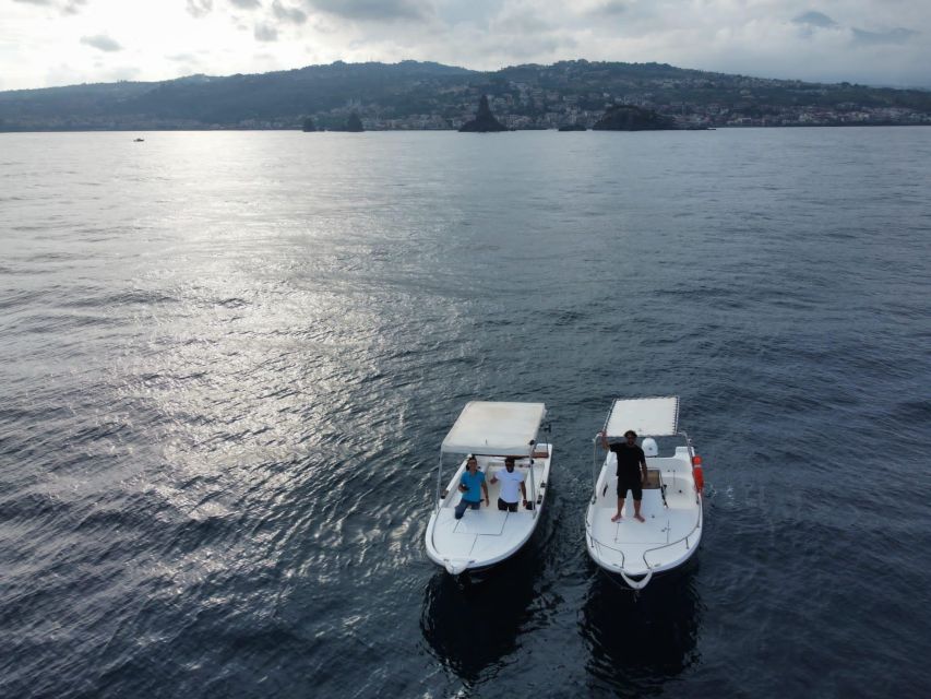 boat tour exploring and searching for dolphins in Acitrezza - The Faraglioni and the story of Polyphemus