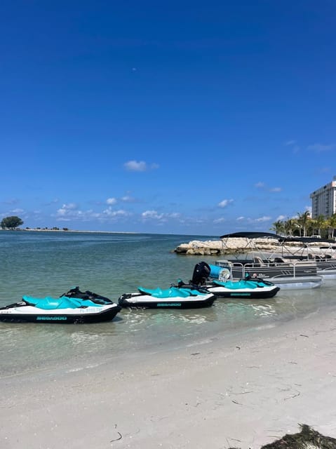 Clearwater: 1 Hour Jetski Dolphin Tour with Guide - Following the Guide Toward Dolphins and Coastline Views