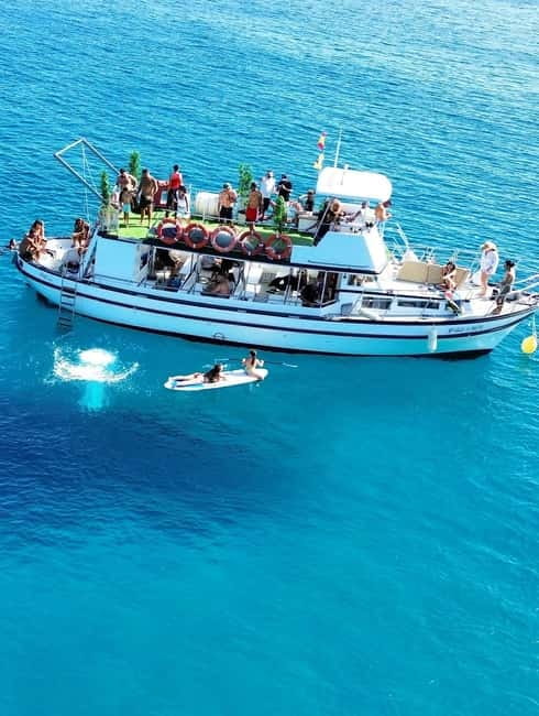 Costa Calma: Fuerteventura Dolphin Watching Boat Tour - Leaving the dock with Morro Jable in view