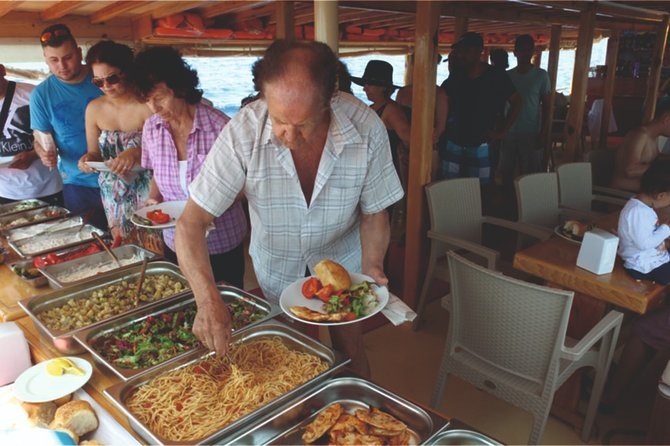 Dolphin Island Boat Trip – Swim, Sun & Lunch Included - Paid drinks, snacks, photographs, and the foam party