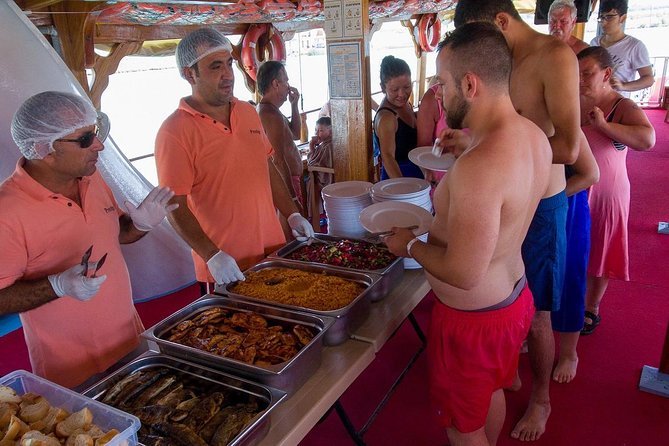 Dolphin Islands Boat Trip Lunch and Soft Drink Included From Side - Sunbathing, snorkeling, and the foam party