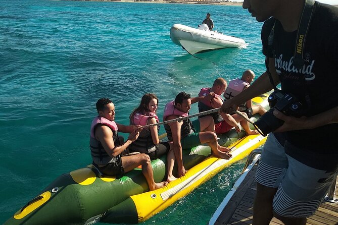 Dolphin tour & banana boat fun with snorkeling from Hurghada - Lunch, drinks, and time back on the boat