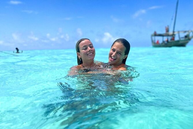Dolphin Tour & Snorkeling at Mnemba Island - Searching for dolphins near Mnemba Island