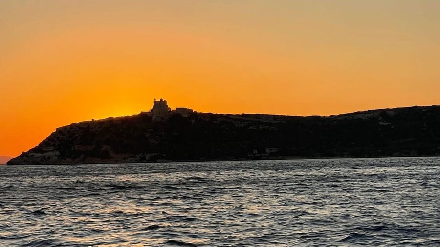 From Cagliari: sunset dolphin watching tour - Cala Bernat beneath the Cala Capo S. Elia lighthouse