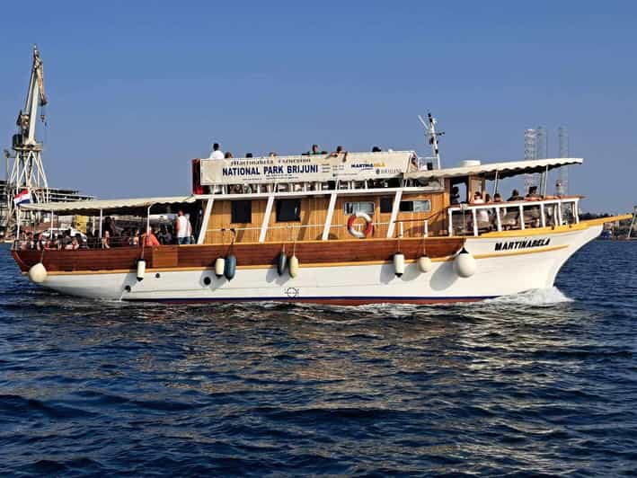 From Fazana: Dolphin watching sightseeing cruise at sunset - Circling Brijuni National Park by boat