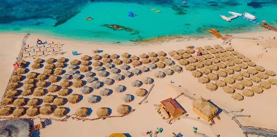 From Hurghada: Hula Hula Island Speedboat Tour with Dolphins - Snorkeling the coral reefs