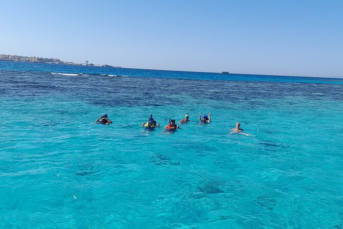 Full-Day Experience with Dolphins and Snorkeling in Red Sea - Two snorkeling stops over coral and fish