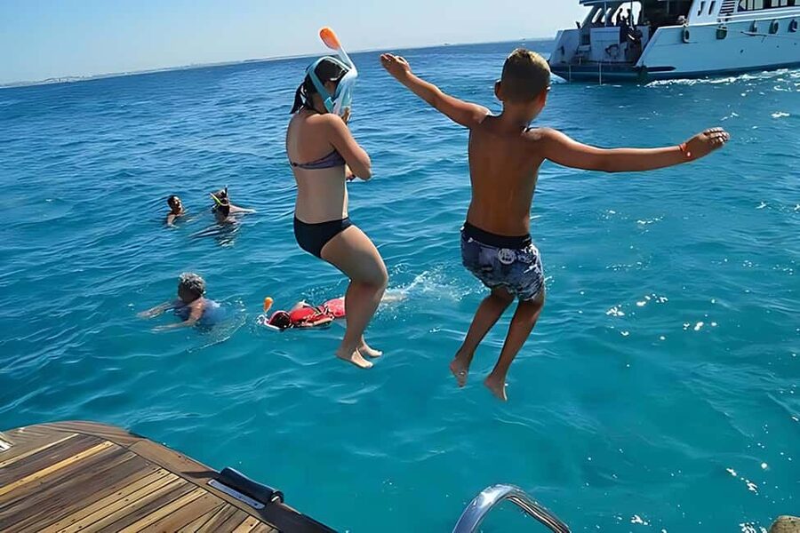 Hurghada: Dolphin Cruise with Snorkeling & Buffet Lunch - Two snorkeling stops at coral reefs