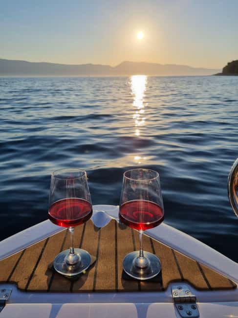 Krk: Sunset Boat Tour with wine, high chance of dolphins - A second stop for swimming and sunset
