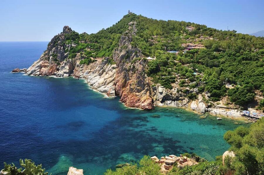 Olbia: Dolphin Watching and Snorkeling Boat Tour - Clear water and fish at Cala Moresca