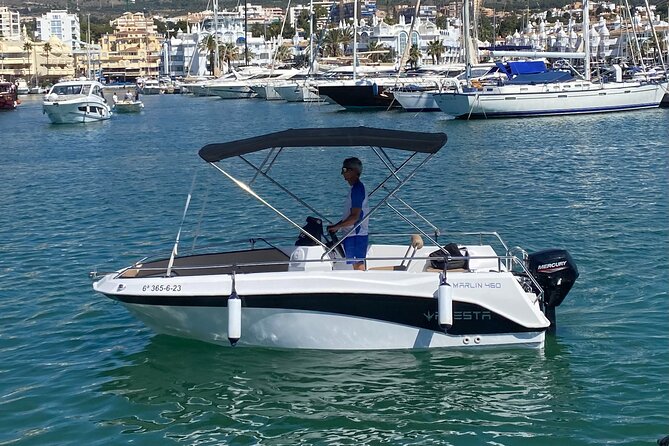 Private boat rental without title dolphin watching - Taking the wheel at Benalmádena’s Puerto Marina