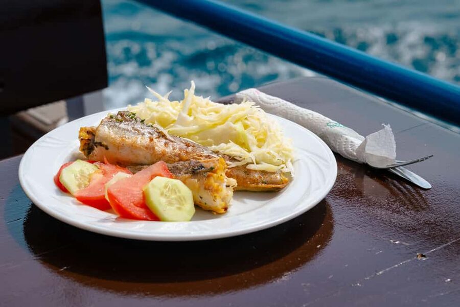 Pula: Private Dolphins & Sunset Tour With Dinner & Drinks - A sunset meal prepared on the boat