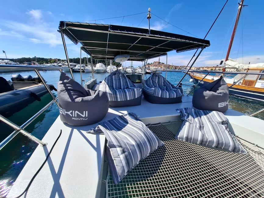 Rovinj: Sunset & dolphin group tours with Catamaran - Massimo’s local stories add real character