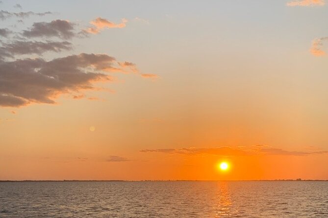 Sunset Dolphin Cruise with Sanibel Lighthouse Views - Turning around Bowditch Point for the main view