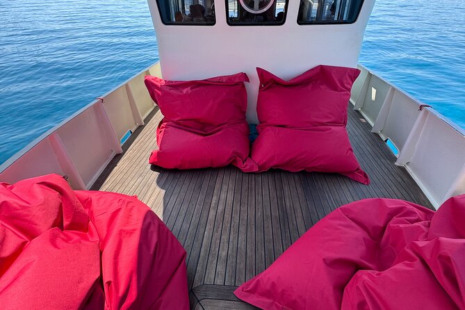Sunset with dolphins on a vintage tugboat in Golfo Aranci - Cruising toward Cala Moresca and Figarolo