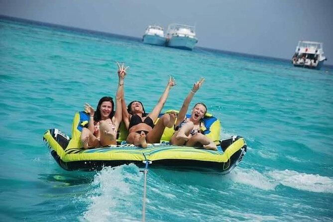Swimming with Dolphins and Banana Boat Sea Trip Day Experience - Hurghada - Banana boat, quadra, and the short thrill rides