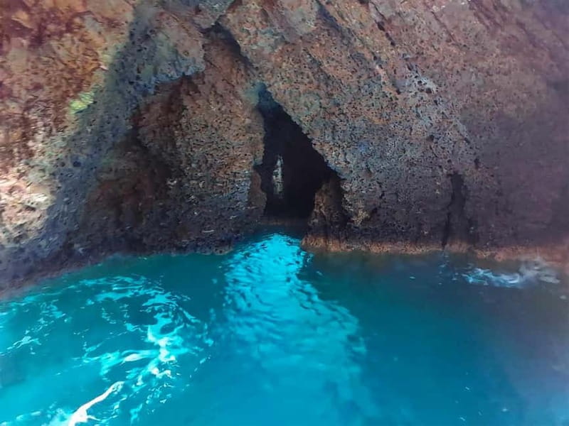 Taormina: Dolphin Tour and Sunset Aperitif Boat Tour - Isola Bella from the water