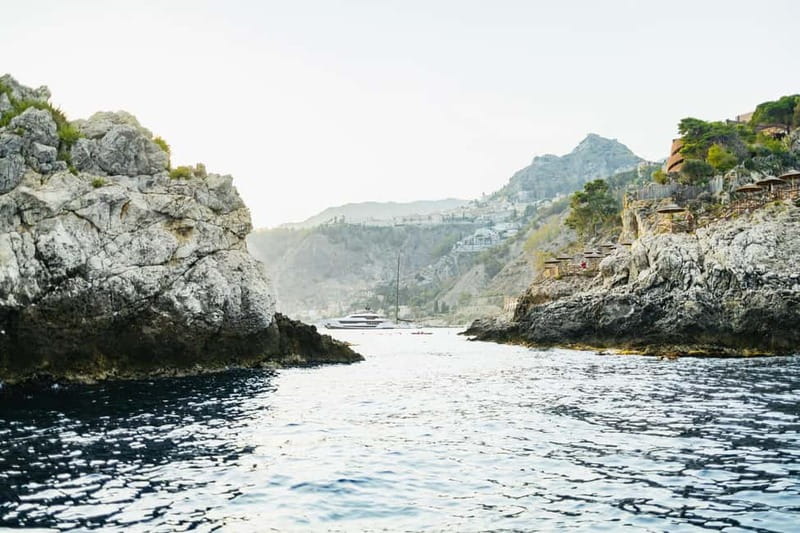 Taormina: Sunset Boat Tour with Dolphin Watching & Aperitif - What the $118.95 price gets you