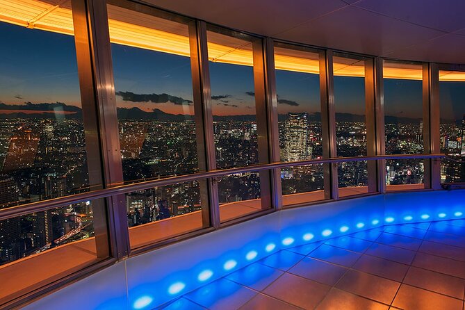 Tokyo Night E-Bike Tour with Tokyo Tower and Dolphin Show - Sengaku-ji Temple adds quiet and history